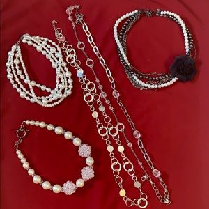 Black, white, silver lot of necklaces.